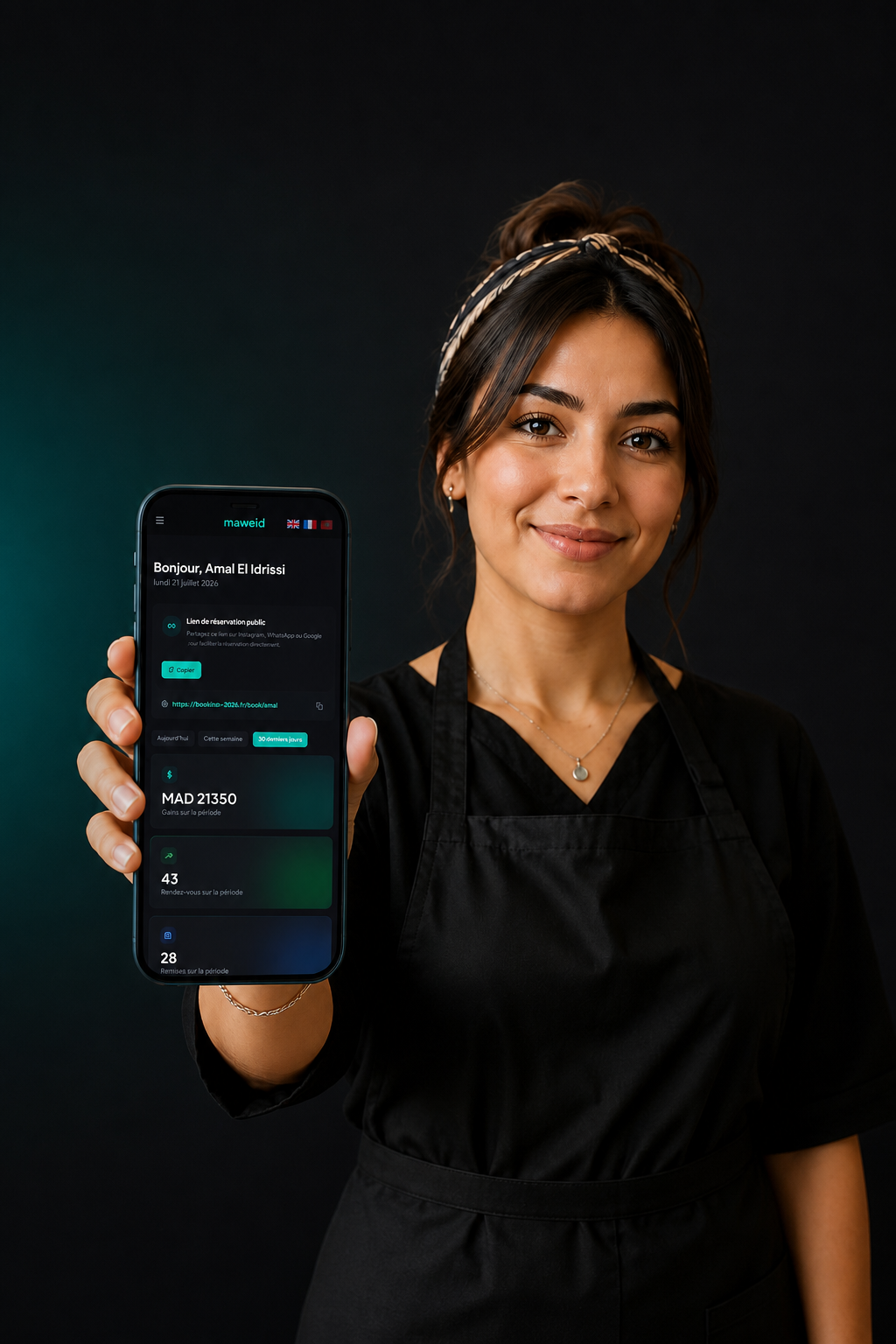 Salon owner holding a phone showing the Maweid booking dashboard